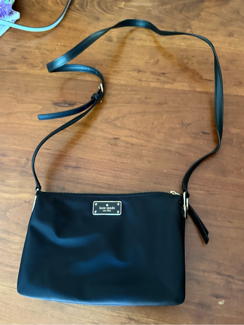 kate spade black nylon crossbody with gold logo plate